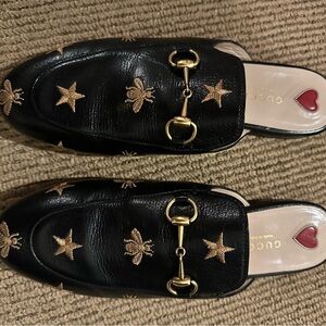 Gucci Black Leather Mules with Gold Embellishments